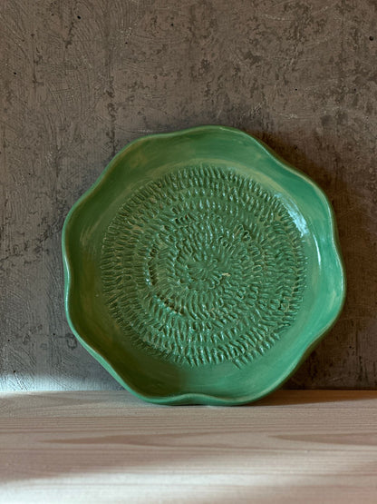 Handmade green ceramic garlic grater
